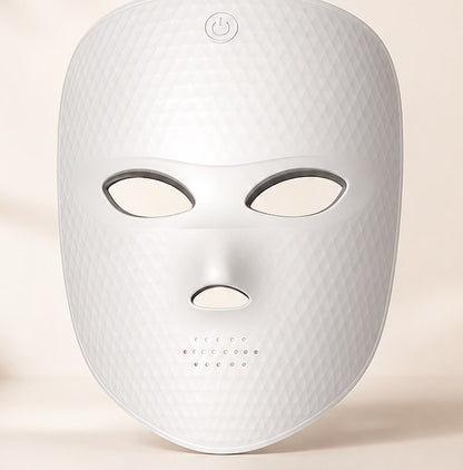 REVELIVA LIGHT MASK shown from the front, a white 7-mode cord-free LED light mask