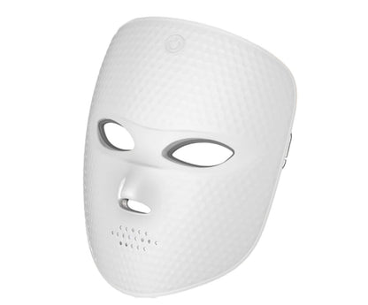 REVELIVA LIGHT MASK, actual product photo showing the white cord-free LED light mask shell, eye openings, and forehead touch control