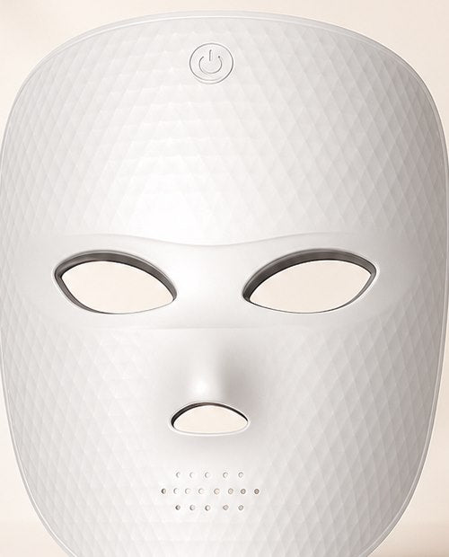 Close-up of the REVELIVA LIGHT MASK forehead touch control